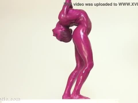 Contortionist tanya twists her body in purple paint